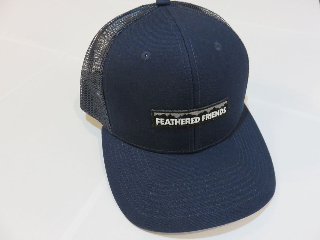 Studio image Feathered Friends Pro Style Mountain Logo Trucker Hat navy and navy colors