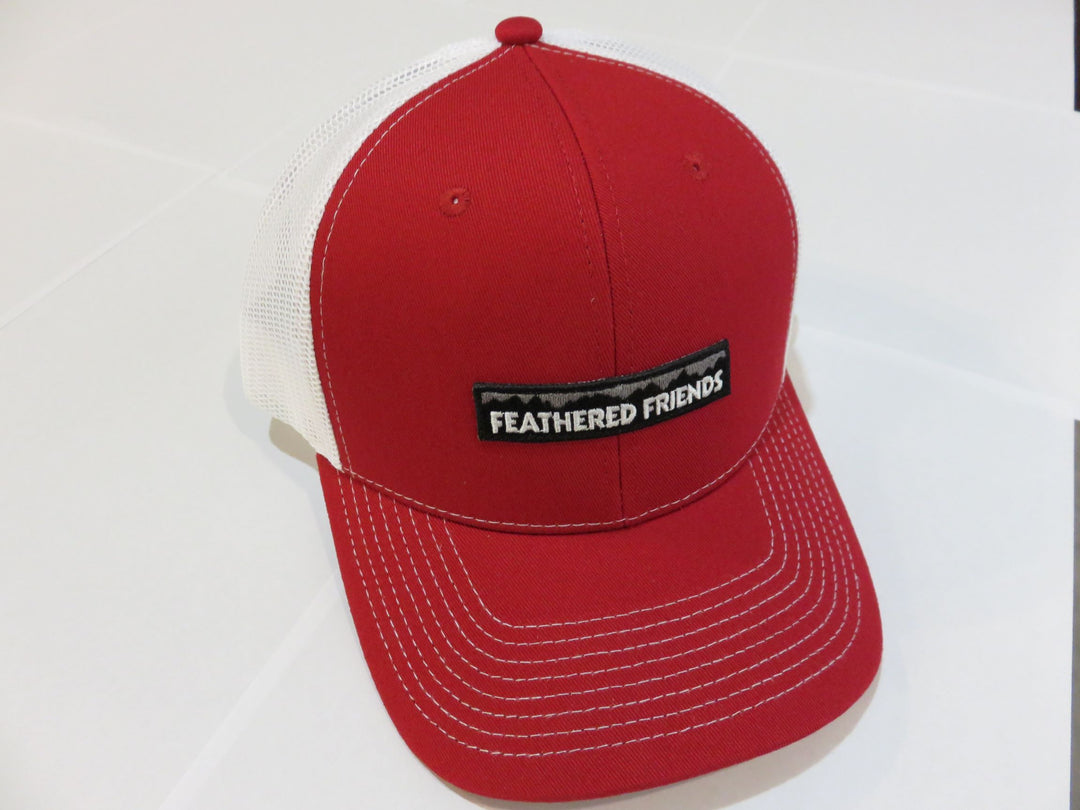 Studio image Feathered Friends Pro Style Mountain Logo Trucker Hat red and white colors