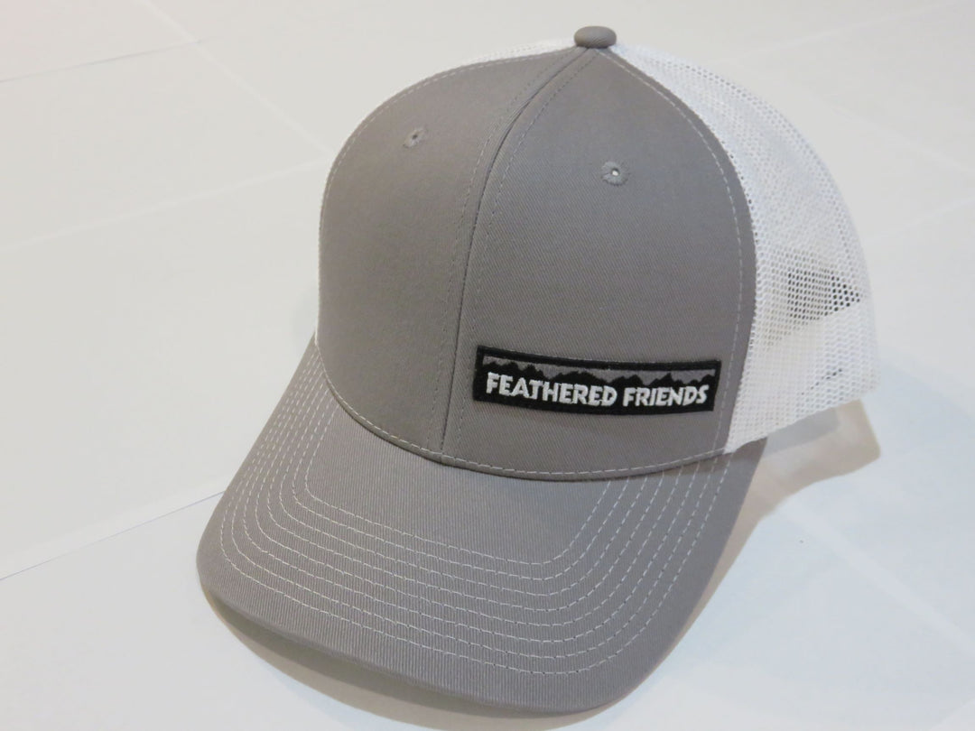 Studio image Feathered Friends Pro Style Offset Logo Trucker Hat grey and white colors