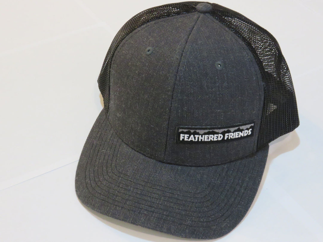 Studio image Feathered Friends Pro Style Offset Logo Trucker Hat heather grey and charcoal black colors