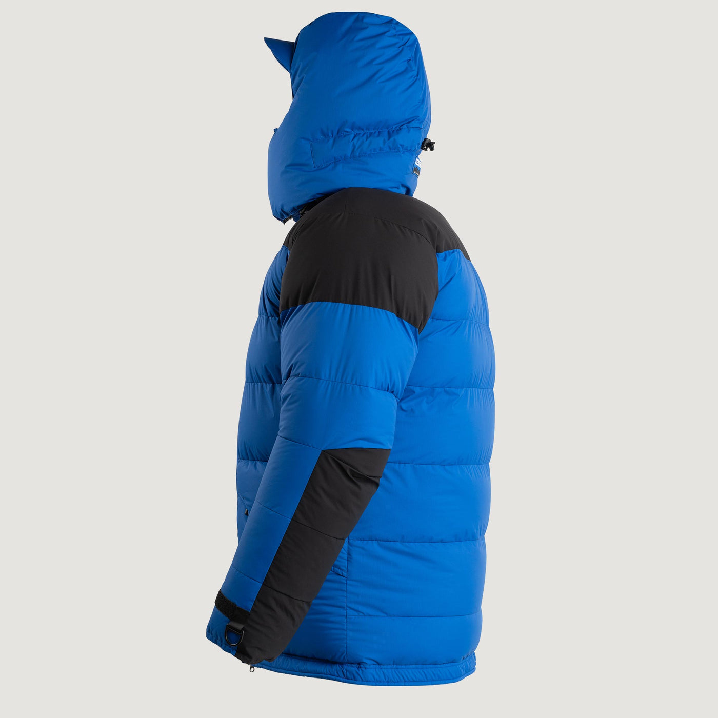 Studio image of the Feathered Friends Rock & Ice Expedition Down Parka Royal Blue color viewed from the side