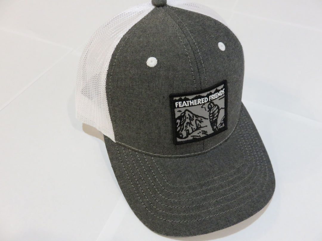 Studio image Feathered Friends Smoking Man Pro Style Trucker Hat Black and White