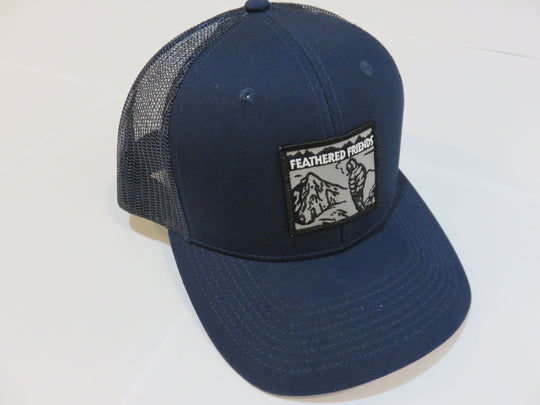 Studio image Feathered Friends Smoking Man Pro Style Trucker Hat navy with navy colors