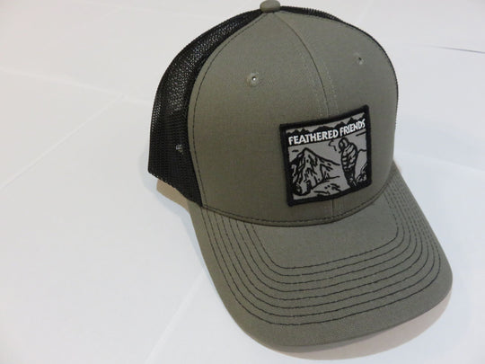 Studio image Feathered Friends Smoking Man Pro Style Trucker Hat olive black colors