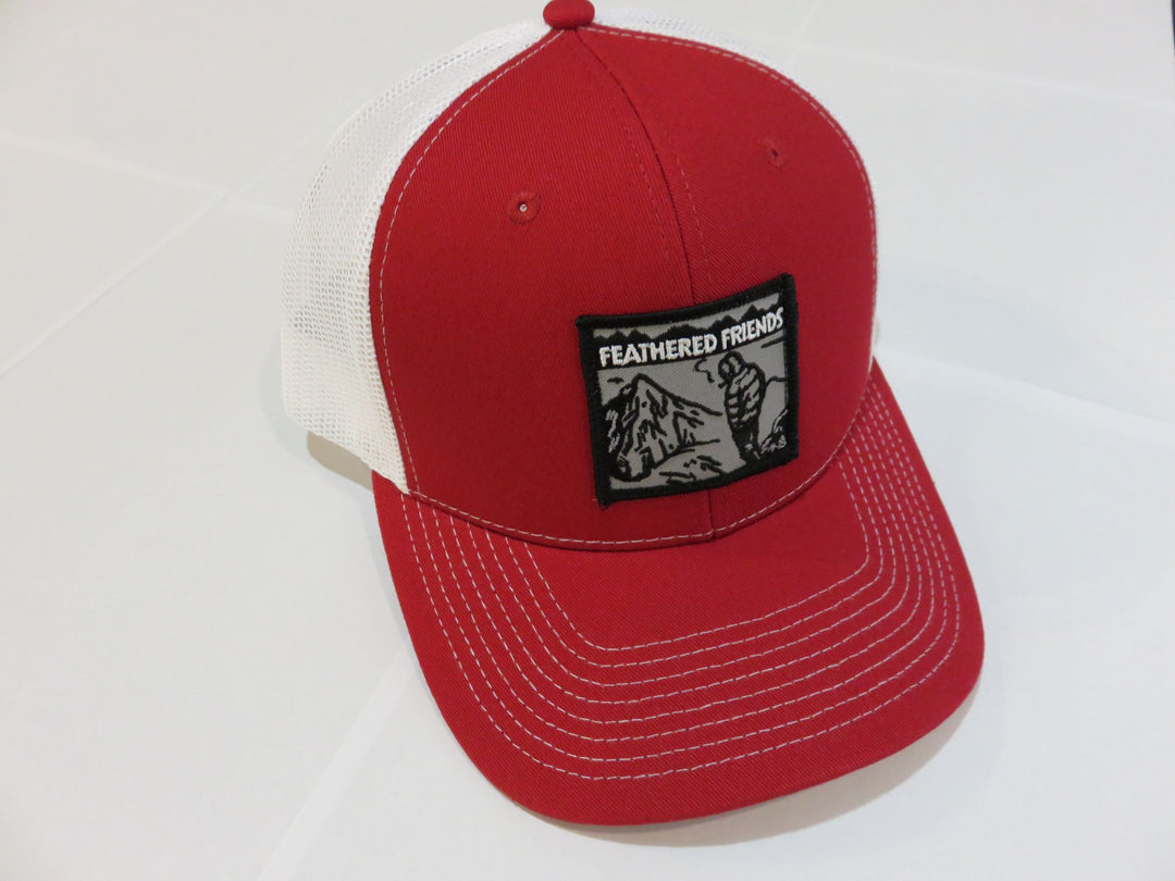 Studio image Feathered Friends Smoking Man Pro Style Trucker Hat red and white colors