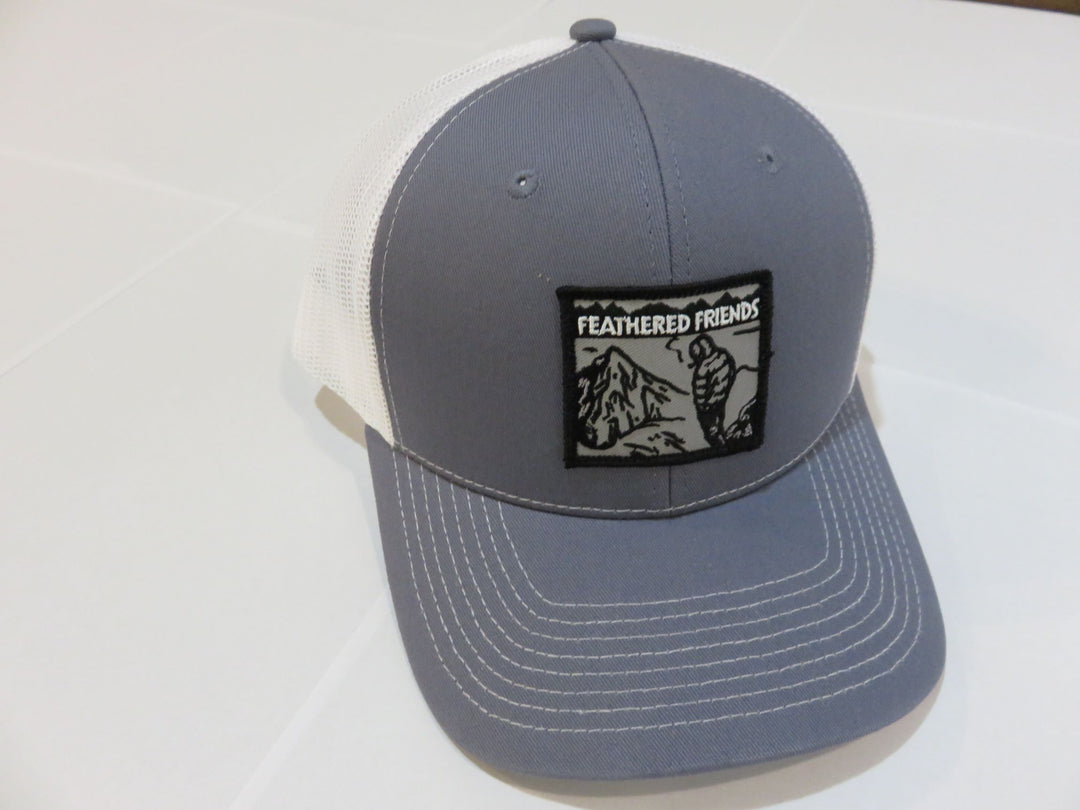 Studio image Feathered Friends Smoking Man Pro Style Trucker Hat steel blue and white colors