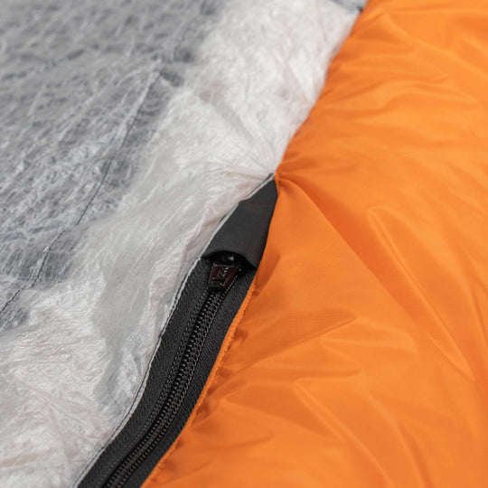 Zipper detail showing zipper garage and Dyneema floor on Flame orange Spoonbill UL 2-Person down sleeping bag