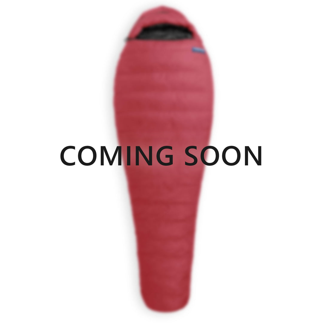 A red Feathered Friends Winter Light sleeping bag with Coming Soon on it