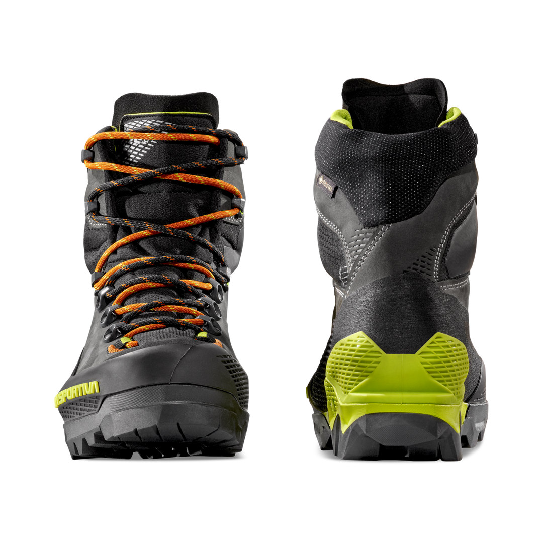 Pair of La Sportiva Aequilibrium LT GTX hiking boots with orange laces and green accent on a white background