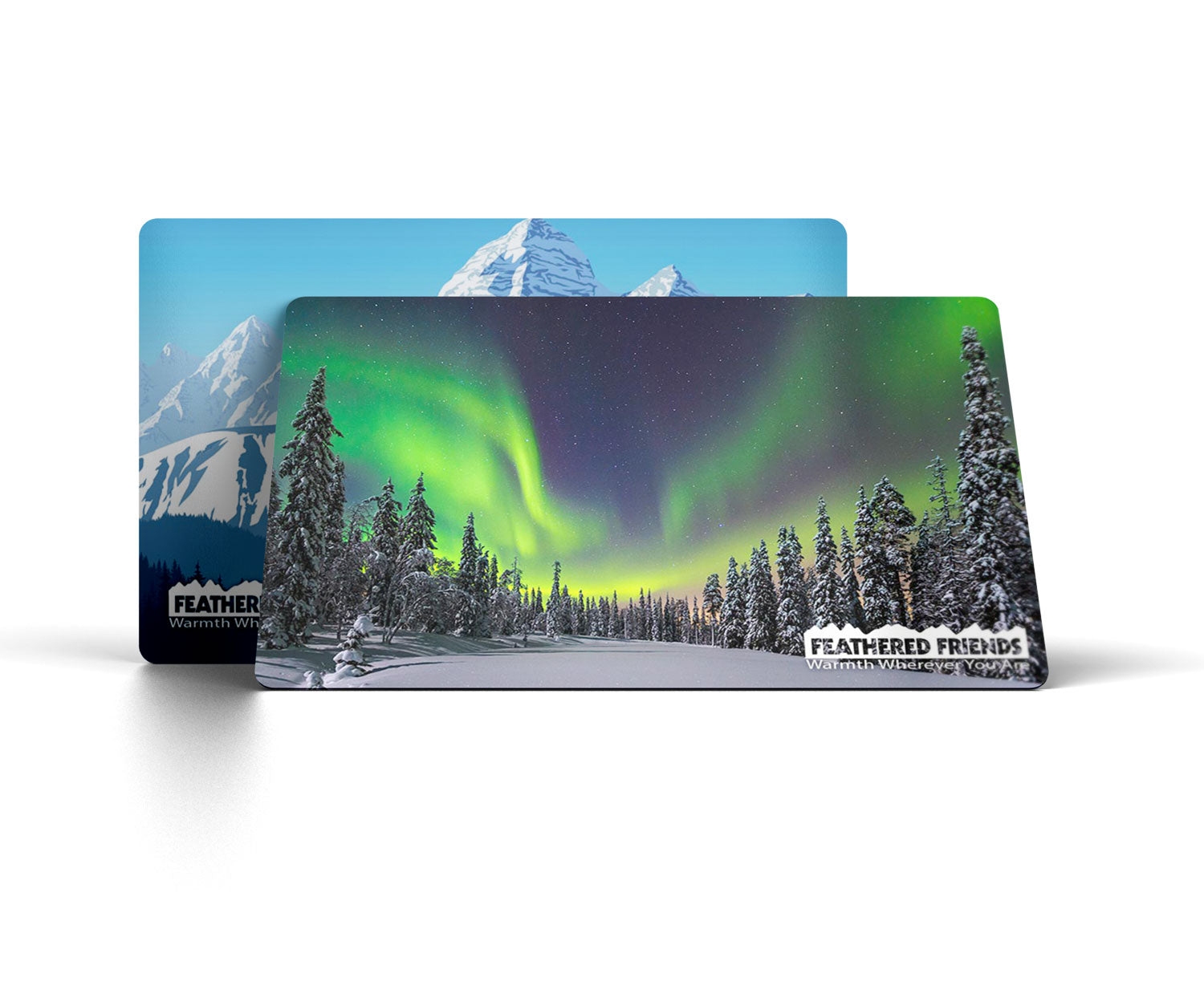 Studio image of the Feathered Friends E-Gift Card, one card with the aurora borealis and another with white mountains