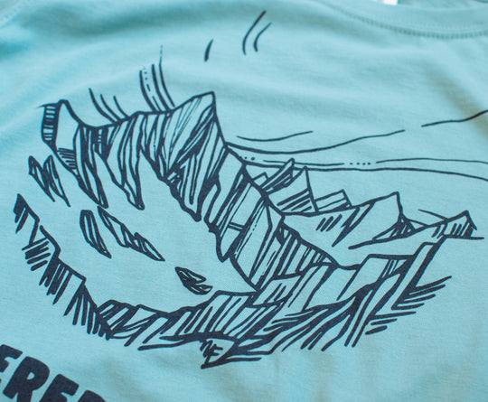 Studio image of Feathered Friends Women's Mountain T-Shirt art detail